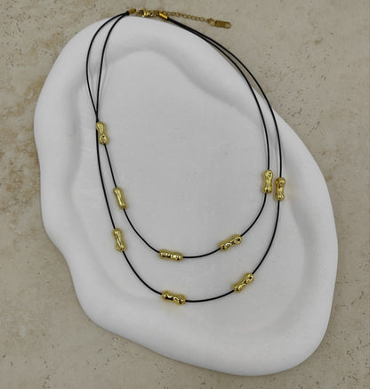 Gold Detaylı Siyah İpli Çelik Kolye